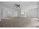 Large living space with a ceiling fan and an open view to the kitchen at 1321 Land Grant Rd, Charlotte, NC 28217