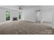 Spacious living area with a fireplace and large windows offering natural light at 1321 Land Grant Rd, Charlotte, NC 28217