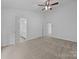 Spacious main bedroom with carpeted floor and ensuite bathroom at 1321 Land Grant Rd, Charlotte, NC 28217