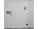 Utility room with white walls, white trim, and tile floors at 1321 Land Grant Rd, Charlotte, NC 28217