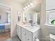Bathroom with double sinks and access to shower and bedroom at 1456 Augustus Beamon Dr, Indian Trail, NC 28079