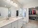 Bright bathroom with double sinks, white cabinets, walk in shower and walk-in closet at 1456 Augustus Beamon Dr, Indian Trail, NC 28079