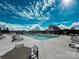 Community swimming pool surrounded by lounge chairs and tables, perfect for relaxation and socializing at 1456 Augustus Beamon Dr, Indian Trail, NC 28079