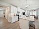 Bright kitchen featuring white cabinets, an island with seating, and modern appliances at 1456 Augustus Beamon Dr, Indian Trail, NC 28079