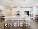 Bright kitchen featuring white cabinets, quartz countertops, and stainless steel appliances, illuminated by pendant lighting at 1456 Augustus Beamon Dr, Indian Trail, NC 28079