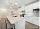 Modern kitchen with a large island, white cabinets, stainless steel appliances, and pendant lighting at 1456 Augustus Beamon Dr, Indian Trail, NC 28079