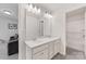 Bathroom features a double sink vanity, a large mirror, and bright lighting at 15630 Oleander Dr, Charlotte, NC 28278