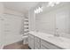 Modern bathroom features a double sink vanity, an enclosed shower, and neutral-colored walls at 15630 Oleander Dr, Charlotte, NC 28278