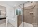 Bathroom featuring shower with glass door, and soaking tub at 15630 Oleander Dr, Charlotte, NC 28278