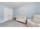 Charming Bedroom with light blue walls, a white crib, and soft natural light at 15630 Oleander Dr, Charlotte, NC 28278