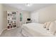 Inviting bedroom with a cozy bed, a large bookcase, and a functional desk area at 15630 Oleander Dr, Charlotte, NC 28278