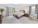 Spacious bedroom featuring a large bed, neutral decor, and plenty of natural light at 15630 Oleander Dr, Charlotte, NC 28278