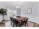 Stylish dining room with elegant decor, featuring a large table, modern chandelier, and natural lighting at 15630 Oleander Dr, Charlotte, NC 28278