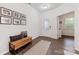 Welcoming entryway featuring wood floors, bench with storage, and ample natural light at 15630 Oleander Dr, Charlotte, NC 28278