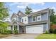 Charming two-story home featuring a two-car garage, manicured lawn, and inviting front porch at 15630 Oleander Dr, Charlotte, NC 28278