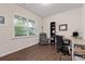 Functional home office with a comfortable chair, built-in bookcase, and an expansive window at 15630 Oleander Dr, Charlotte, NC 28278
