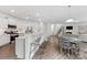 Open floor plan with kitchen, dining area and living area. Has stainless appliances and hardwood floors at 15630 Oleander Dr, Charlotte, NC 28278
