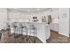 Modern kitchen featuring white cabinets, stainless steel appliances, and breakfast bar seating at 15630 Oleander Dr, Charlotte, NC 28278