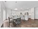 Bright kitchen with modern appliances, a center island, and a dining table with chairs at 15630 Oleander Dr, Charlotte, NC 28278