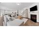 Inviting living room features a fireplace, a large sectional sofa, and hardwood floors at 15630 Oleander Dr, Charlotte, NC 28278