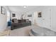 Relaxing living room boasts a plush gray sofa, soft lighting, and neutral tones at 15630 Oleander Dr, Charlotte, NC 28278