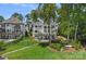 Spacious backyard featuring lush lawn, mature trees, a swimming pool, and a charming walkway, providing a serene outdoor space at 17938 John Connor Rd, Cornelius, NC 28031