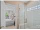 Modern bathroom featuring a glass-enclosed shower with white tile and a built-in bench at 17938 John Connor Rd, Cornelius, NC 28031