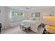 Bright bedroom featuring a large window, neutral decor, and a comfortable, inviting atmosphere at 17938 John Connor Rd, Cornelius, NC 28031