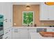 Close-up of a stylish kitchen with a modern faucet and backsplash, and ample counter space at 17938 John Connor Rd, Cornelius, NC 28031