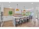 Modern kitchen with a center island, barstool seating, stainless appliances, and stylish finishes at 17938 John Connor Rd, Cornelius, NC 28031