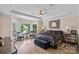 Serene main bedroom with tray ceilings, bay window overlooking the river and plush furnishings at 17938 John Connor Rd, Cornelius, NC 28031