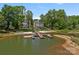 Stunning waterfront property with a private dock, providing access to the lake and showcasing the home's beautiful backyard at 17938 John Connor Rd, Cornelius, NC 28031