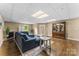 Spacious finished basement with a cozy seating area, fireplace, and wood-look flooring at 1825 Smyre Farm Rd, Newton, NC 28658
