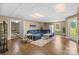 Finished basement area with wood floors, comfortable seating, and natural light at 1825 Smyre Farm Rd, Newton, NC 28658