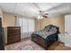 Finished basement bedroom featuring dark wood furniture, carpet floors, ceiling fan and ample natural light at 1825 Smyre Farm Rd, Newton, NC 28658