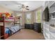 Cozy bedroom with bunk beds, natural light, and neutral tones, creating a warm and inviting space at 1825 Smyre Farm Rd, Newton, NC 28658