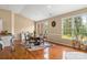 Inviting dining room with hardwood floors, complemented by abundant natural light from large windows at 1825 Smyre Farm Rd, Newton, NC 28658