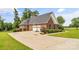 Brick home with a spacious driveway, two-car garage, and basketball hoop at 1825 Smyre Farm Rd, Newton, NC 28658