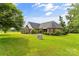 Traditional brick home with well maintained lawn and landscaping, under a sunny blue sky at 1825 Smyre Farm Rd, Newton, NC 28658