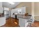 Modern kitchen with white cabinets, stainless steel appliances, and bar seating area at 1825 Smyre Farm Rd, Newton, NC 28658