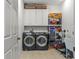 Functional laundry room with washer, dryer, and ample storage space for supplies at 1825 Smyre Farm Rd, Newton, NC 28658