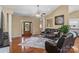 Bright living room featuring hardwood floors, a cozy sofa, and an inviting front entrance at 1825 Smyre Farm Rd, Newton, NC 28658