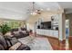 Spacious living room with vaulted ceiling, hardwood floors, and a cozy seating area at 1825 Smyre Farm Rd, Newton, NC 28658