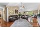 Open-concept living area with hardwood floors, comfortable seating, and large windows at 1825 Smyre Farm Rd, Newton, NC 28658