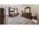 Spacious main bedroom with tray ceiling, canopy bed, sitting area and ensuite bathroom at 1825 Smyre Farm Rd, Newton, NC 28658