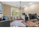 Home office with hardwood floors, a large window for natural light, and ample desk space for productivity at 1825 Smyre Farm Rd, Newton, NC 28658