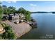 Gorgeous waterfront home with lush greenery, private dock, and stunning lake views. For sale canopy 2025 at 204 Ridge Dr # 12 12-1 12-2, Troy, NC 27371
