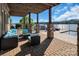 Serene backyard patio with lake views, pool, and comfortable seating, ideal for outdoor living at 204 Ridge Dr # 12 12-1 12-2, Troy, NC 27371