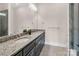 Bathroom with a granite countertop, double sinks, and modern fixtures at 204 Ridge Dr # 12 12-1 12-2, Troy, NC 27371