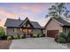 Charming home exterior with a well-manicured lawn, mature landscaping, and inviting entrance. For sale canopy 2025 at 204 Ridge Dr # 12 12-1 12-2, Troy, NC 27371